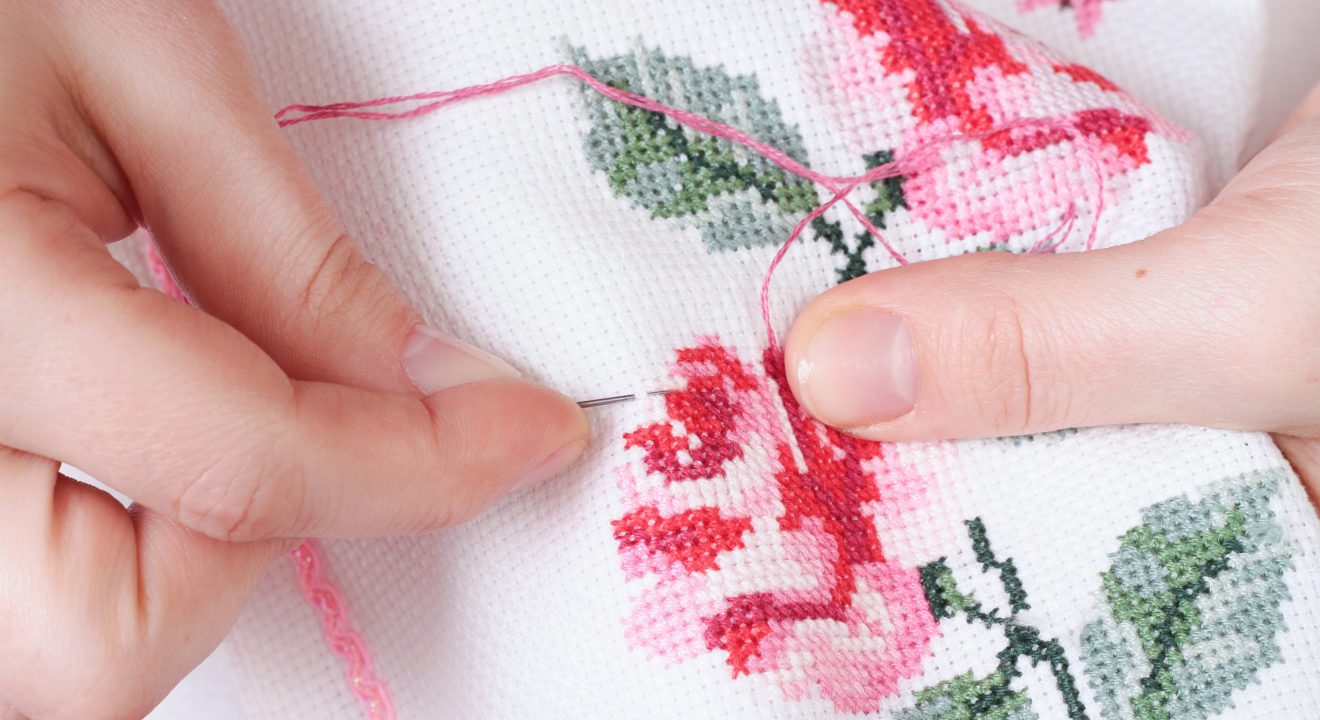 Entity reports on the lifetime hobbies you can start in your twenties, including cross stitching.