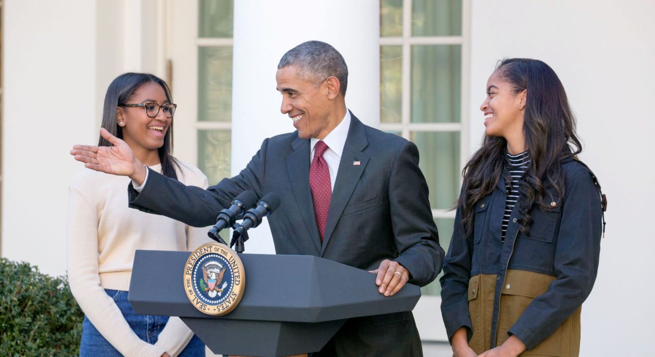 ENTITY reports on President Obama with his two daughters, Malia and Sasha.