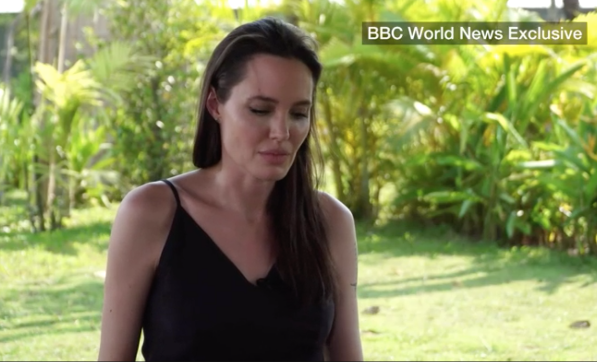 Entity reports that Angelina Jolie looked pained after BBC’s Yalda Hakim asked about the “incident” that led to her divorce. 