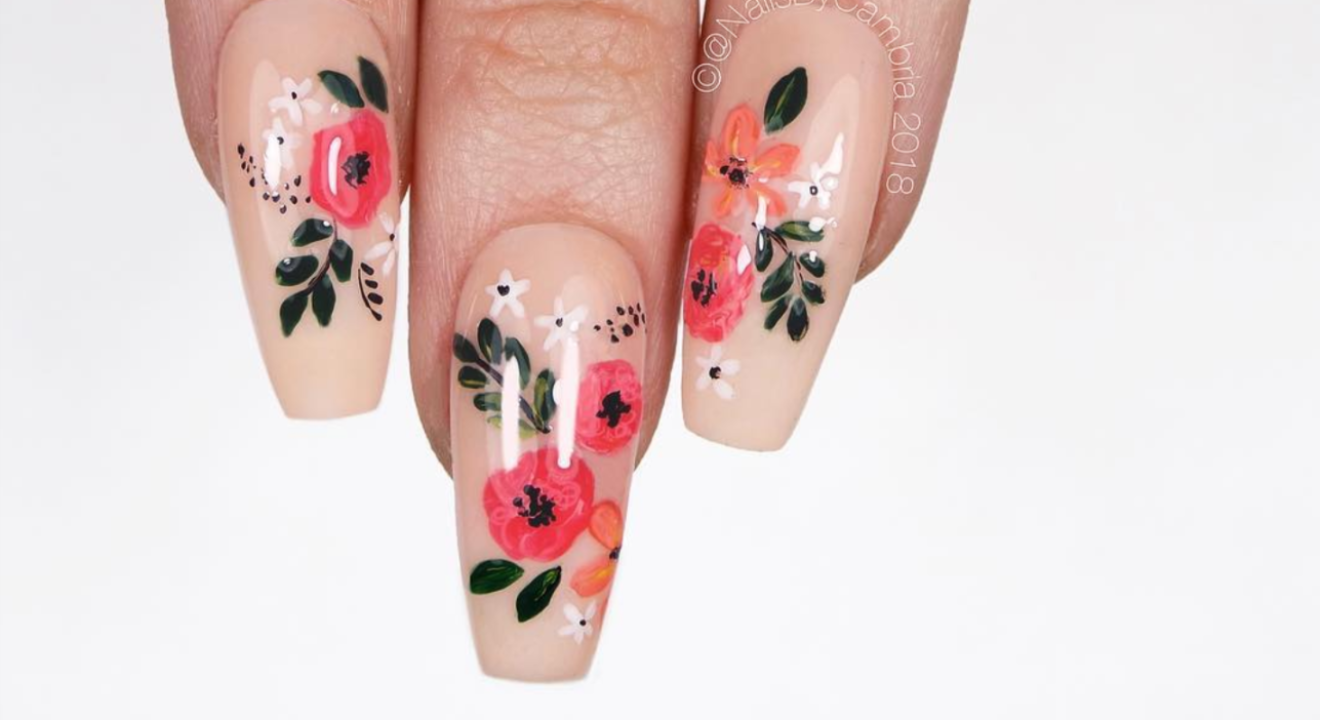 ENTITY shares Instagram and YouTube experts you have to follow for the latest nail polish trends. Photo of floral nails by Cambria Proskine (@nailsbycambria on Instagram).