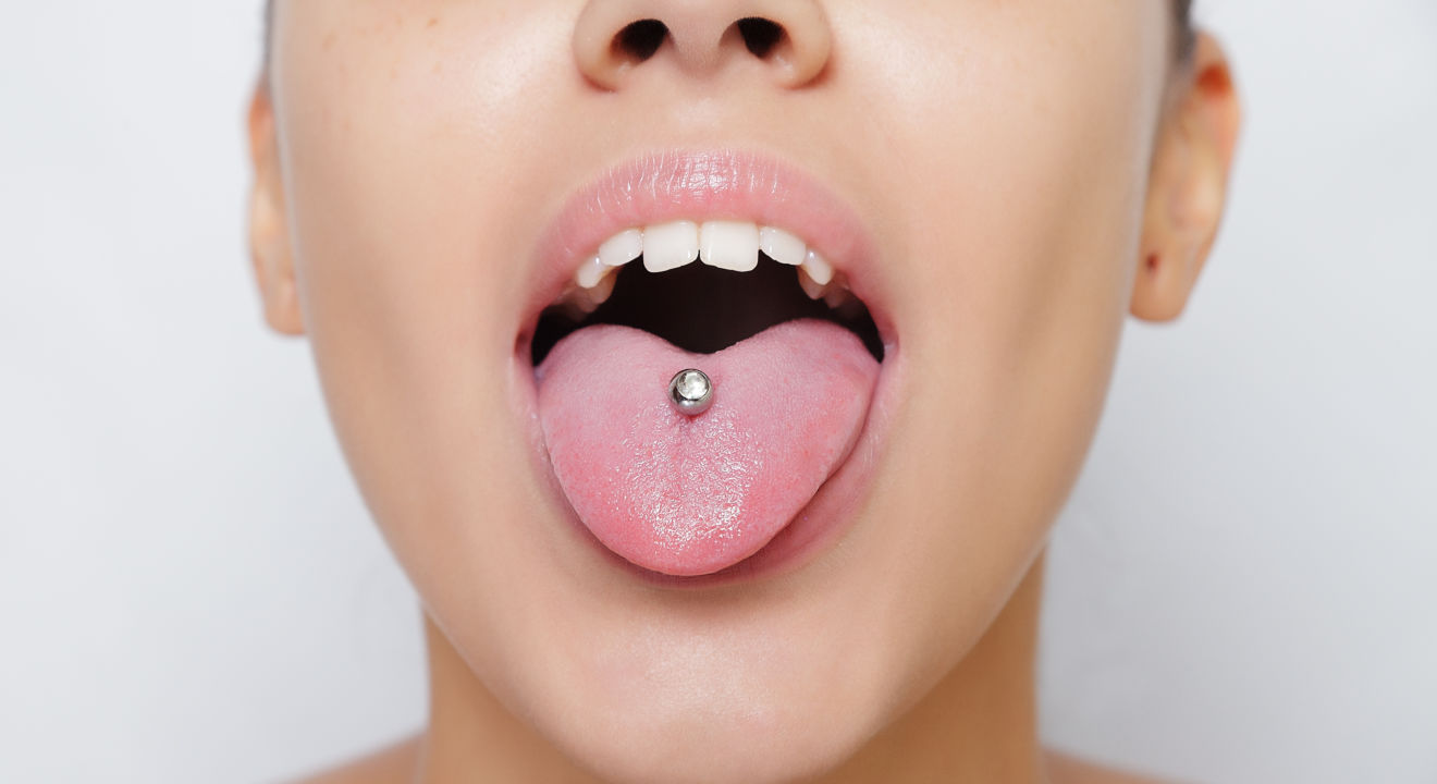 Image result for tongue piercing on africans