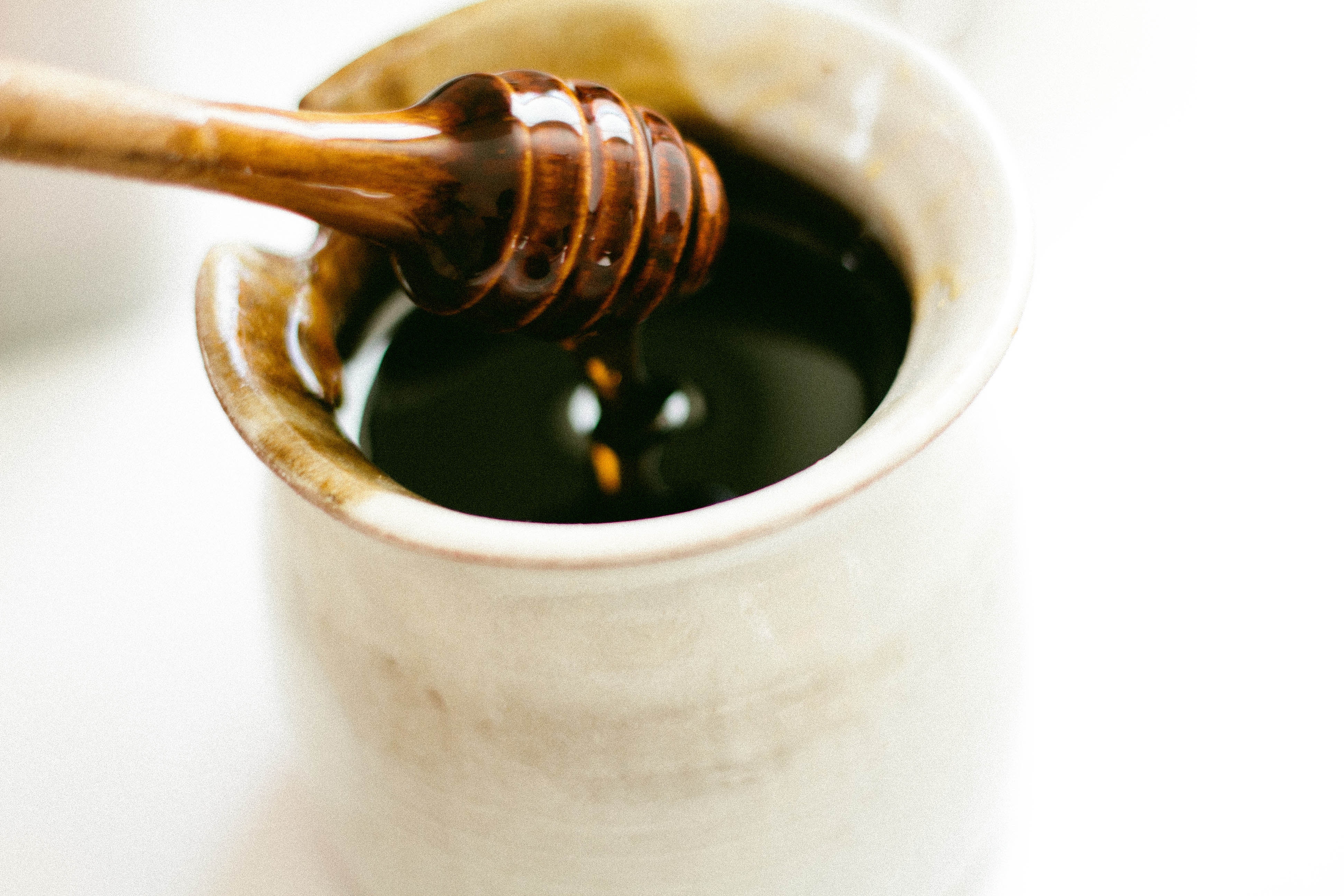 ENTITY shares 7 DIY face masks. Honey is an easy, all-natural ingredient to include. PHOTO OF HONEY VIA UNSPLASH/@SONJALANGFORD