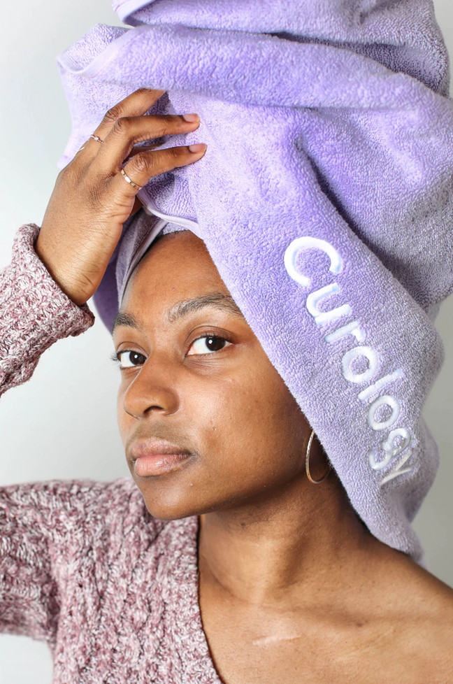 ENTITY shares image of girl with towel on head via Unsplash