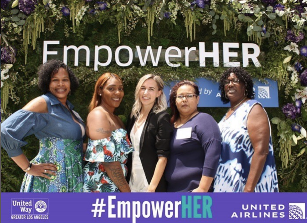 Entity shares a photo of Caitlin Crosby's employees at the EmpowerHER awards.