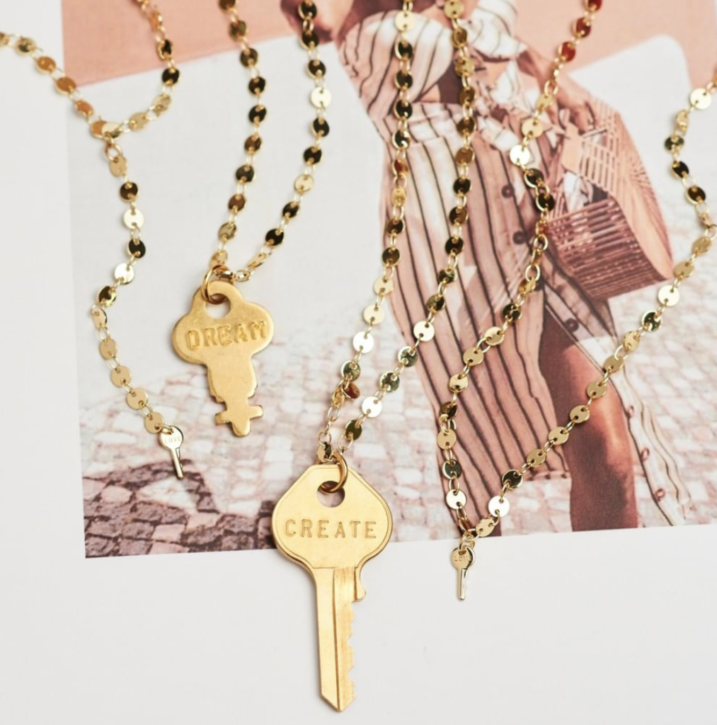 Entity shares a photo of The Giving Keys merchandise. 