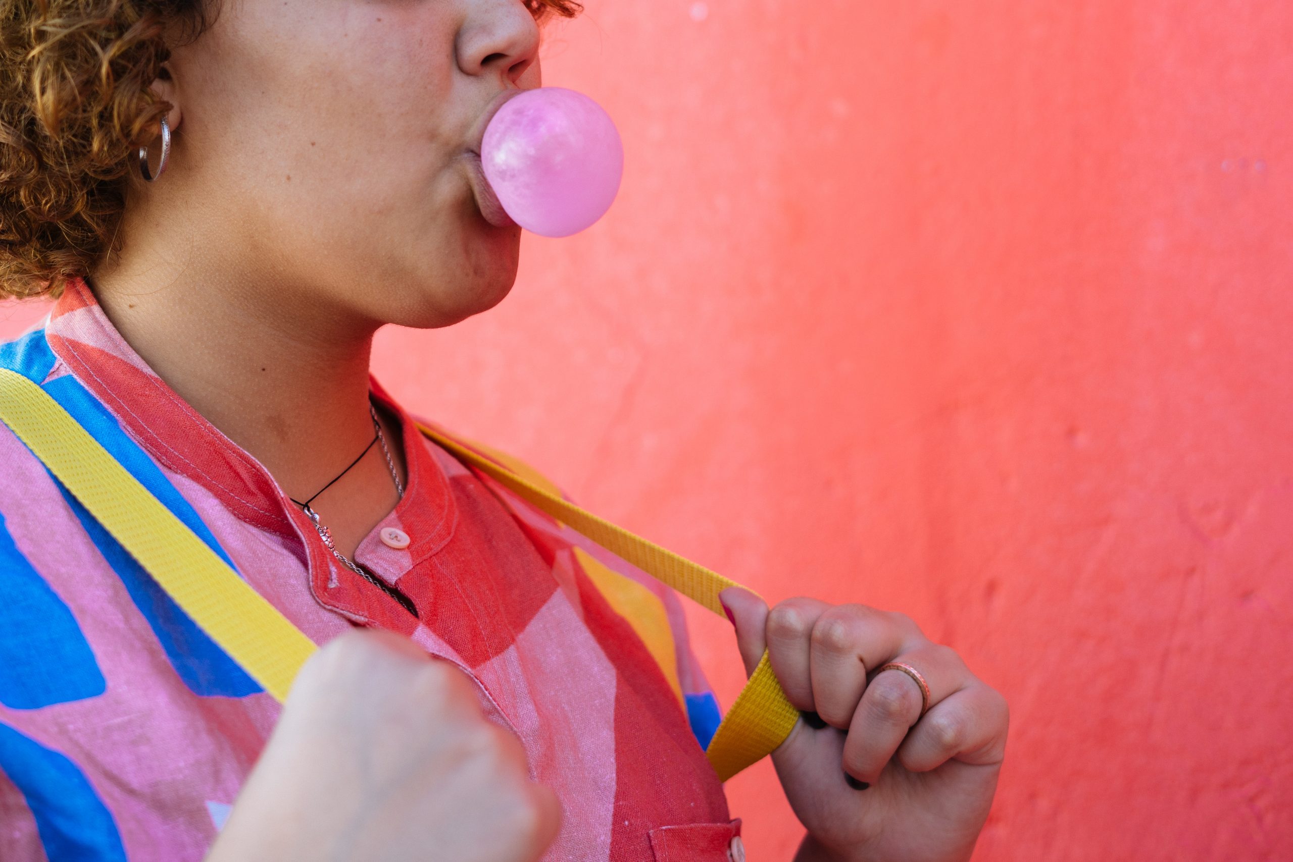 Anonymous Colorful Lady Blowing Gum Bubble In Street ENTITY