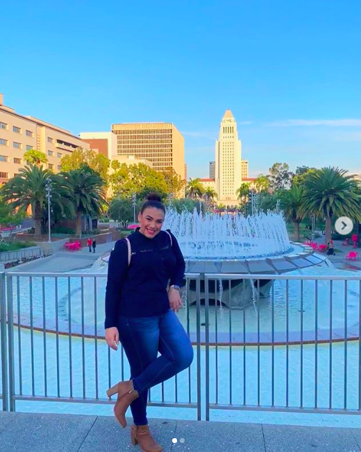 Entity shares photo of fun things to do in downtown LA- woman by the fountain at Grand Park