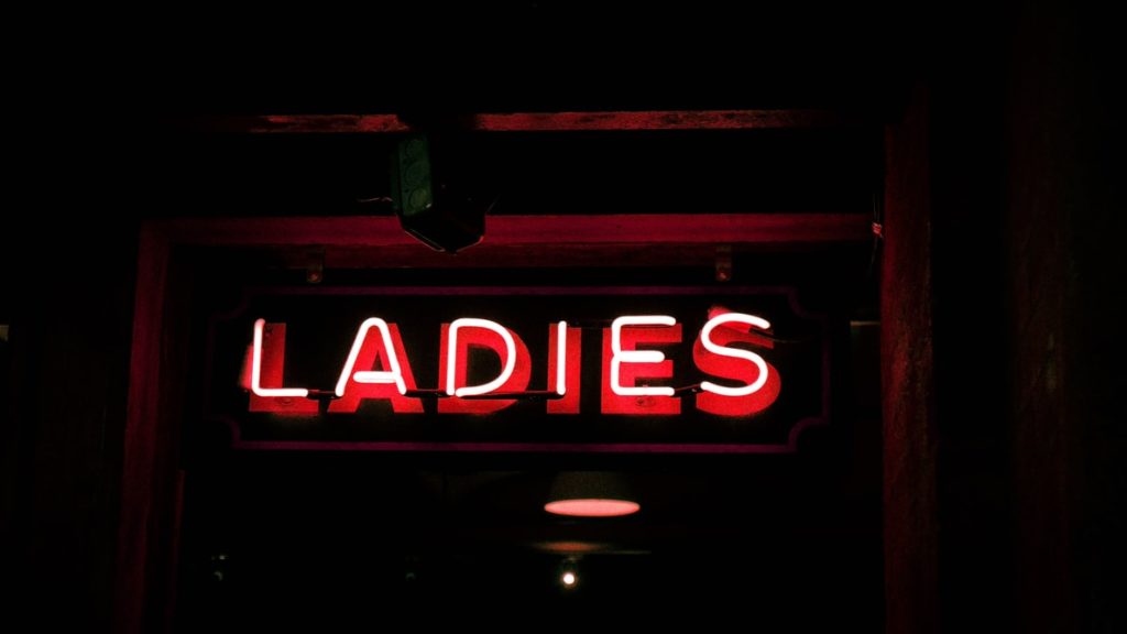 Red neon sign that reads, "ladies" - taken from unsplash