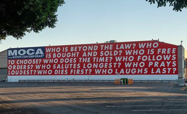 Entity shares photo of fun things to do in downtown LA- MOCA powerful art piece, "who is beyond the law?" 