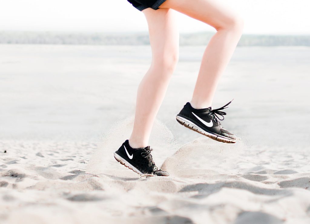 Photo of a woman running on the beach from Pexels