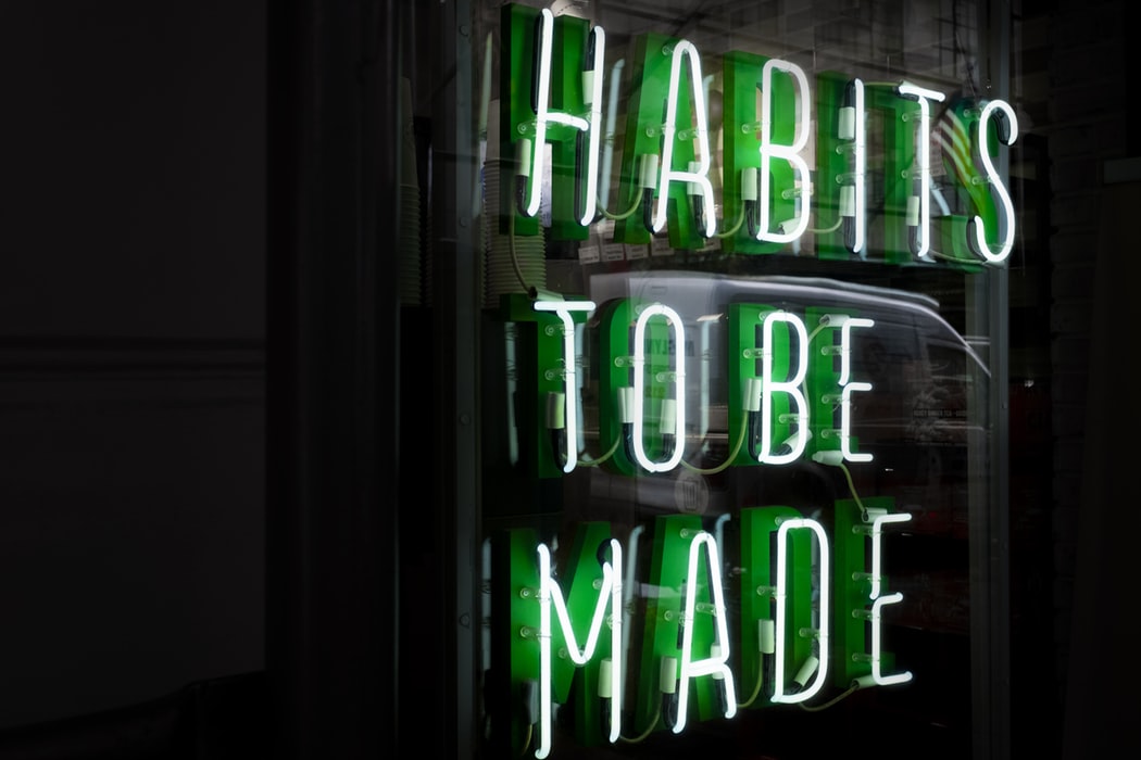 Green neon sign that says, "habits to be made" via Unsplash