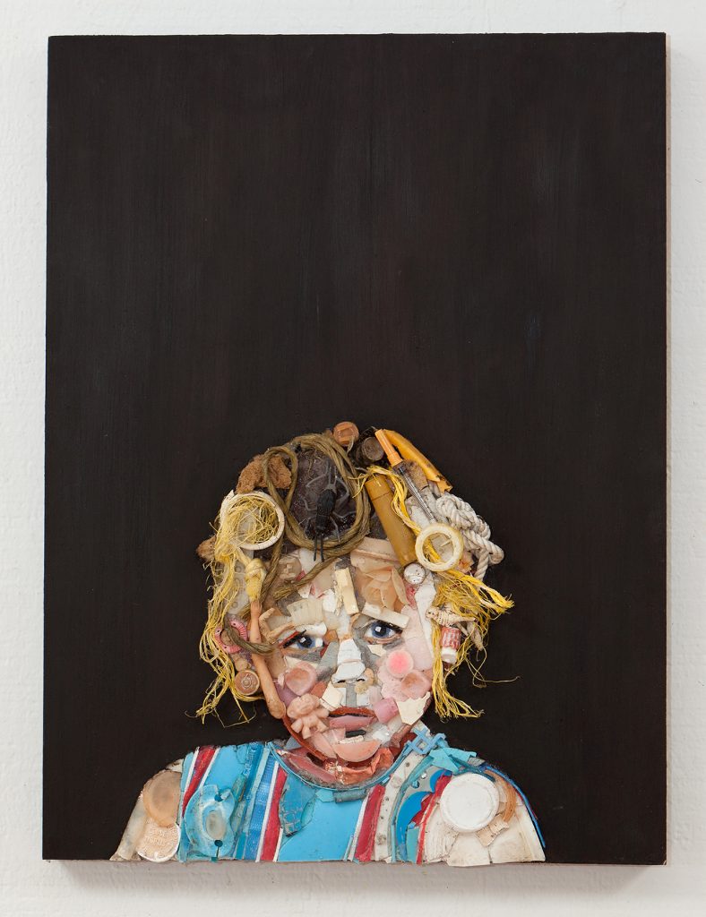 A self-portrait of artist Tess Felix as a little girl, made of recycled ocean plastics.