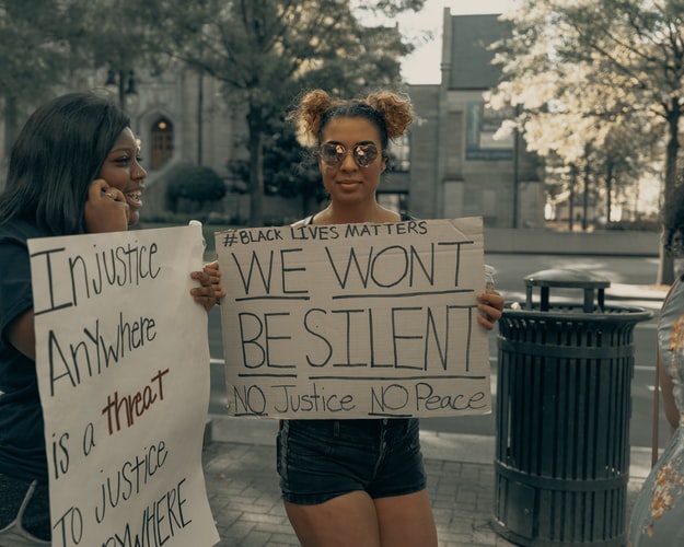 ENTITY Shares photo by Clay Banks from a protest about police brutality.
