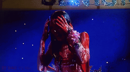Gif of Carrie covered in blood and screaming as the camera zooms in. ENTITY Mag tells you what to be for halloween based on your zodiac sign.