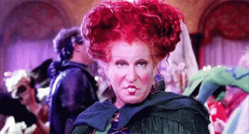 Gif of Winnie Sanderson putting her finger to her temple. Who would you be for halloween based on your zodiac?