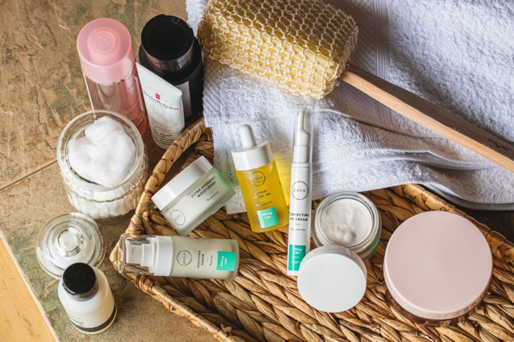 Bird's eye view image of assorted skincare products in jars and bottles.